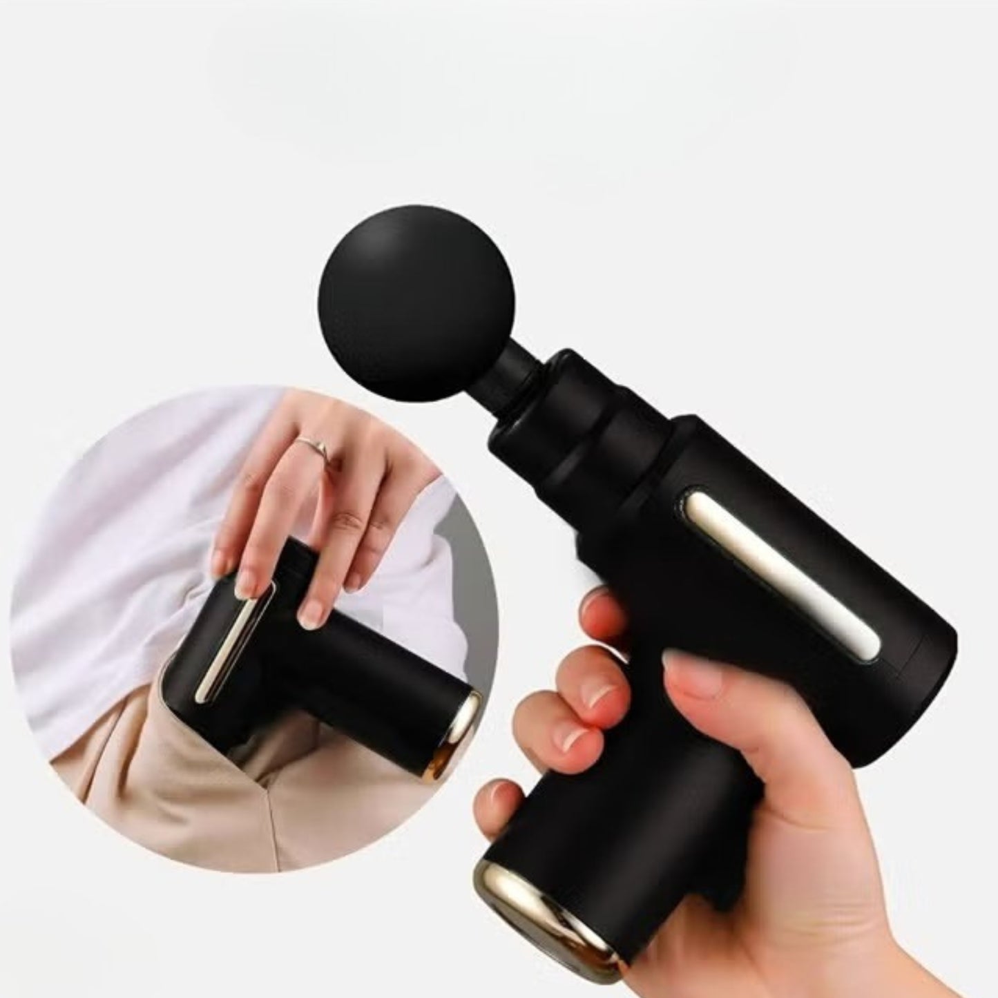 Black massage gun held by a hand with a close-up fitting into pants pocket.