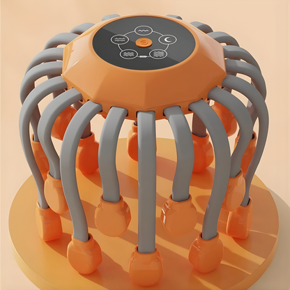Orange and gray scalp massager with multiple flexible arms on a beige background